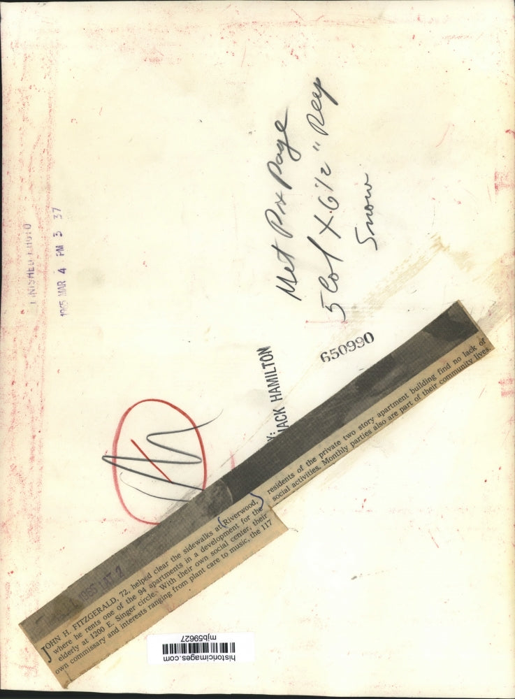 1965 Press Photo John Fitzgerald shovels snow at Riverwood seniors apartments