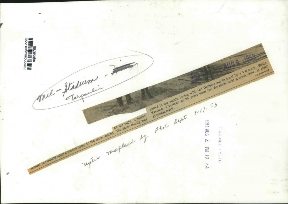 1953 Press Photo Umpires inspect infield after rain delay, Milwaukee Stadium