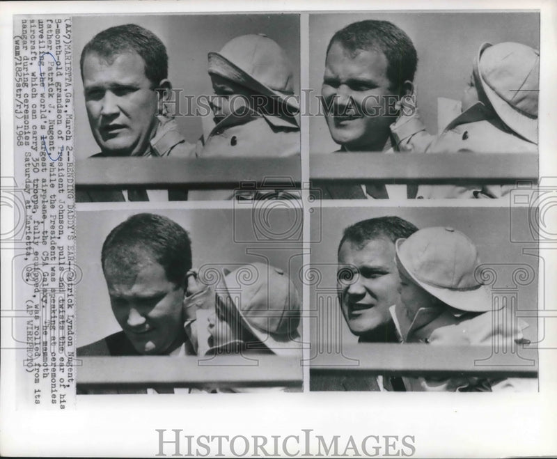 Load image into Gallery viewer, 1968 Press Photo Patrick Lyndon Nugent twists dad ear at unveiling C5A Galaxy

