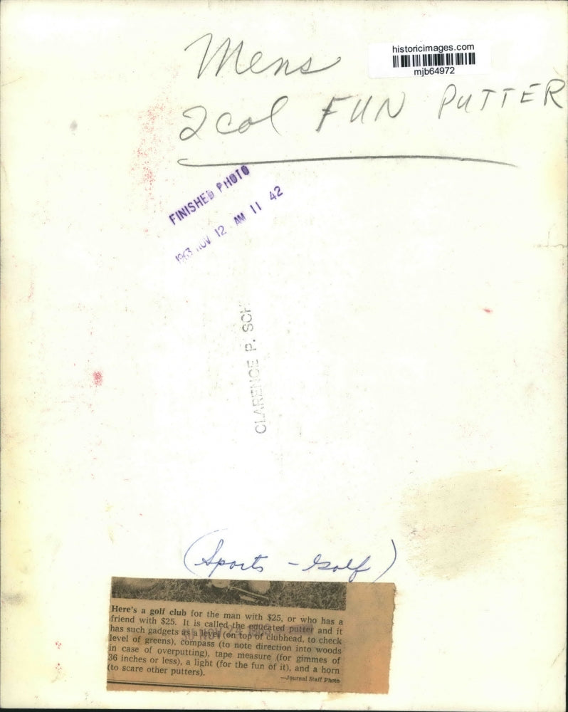 1963 Press Photo Man measuring length of golf with Fun Putter at Milwaukee sport