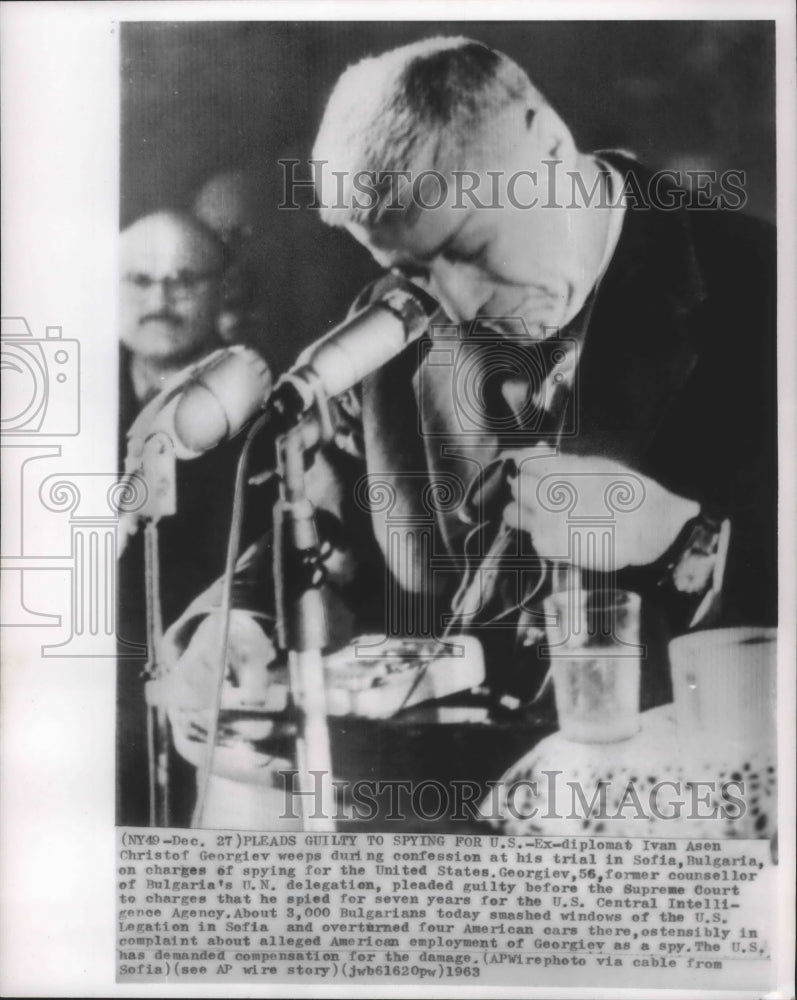 Load image into Gallery viewer, 1963 Press Photo Former Diplomat bowed head at his trial for spying, Bulgaria
