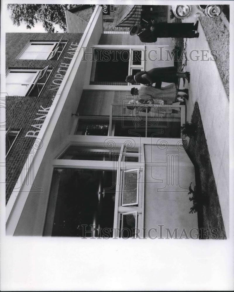 Load image into Gallery viewer, 1957 Press Photo Fence at Waukesha county bank removed in a remodeling program
