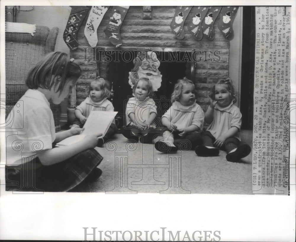 1965 Press Photo Kathy Axe Reads Story To Her Quadruplet Sisters In Toledo, Ohio- Historic Images