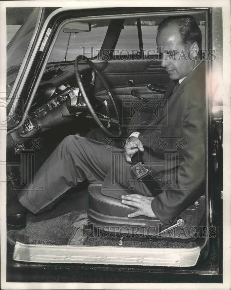 Load image into Gallery viewer, 1961 Press Photo Milwaukee Governor Nelson fastening seatbelt in his car
