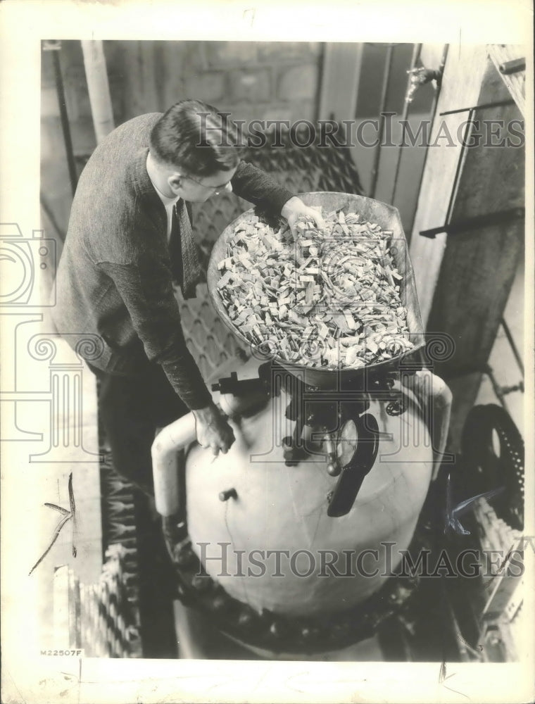 1938 Press Photo Wood put into machine that will process into cellulose fibers- Historic Images