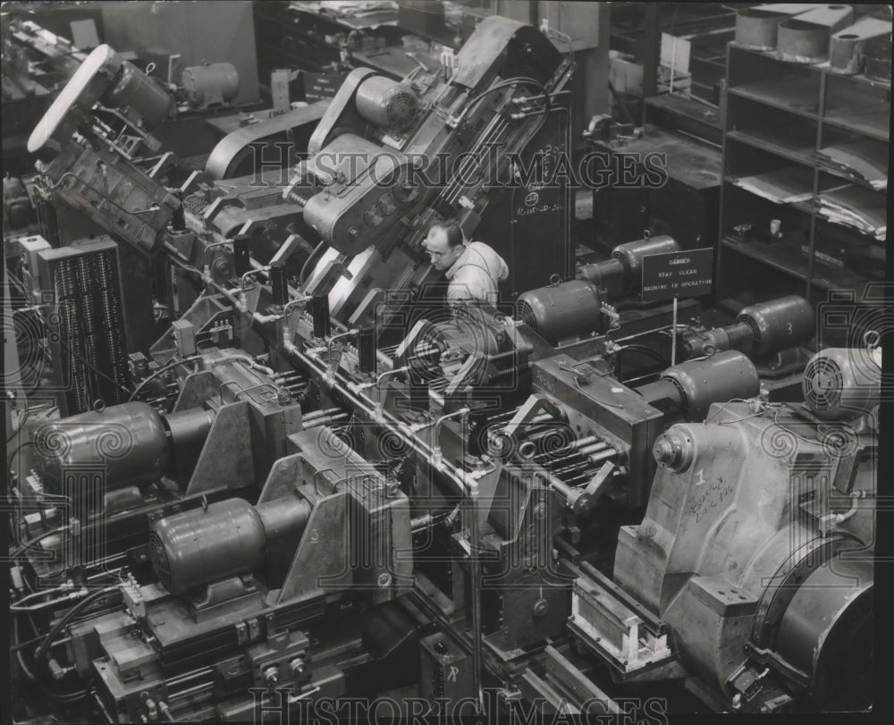1954 Press Photo Joseph Zacher displays casting that turns out caps, Wisconsin.