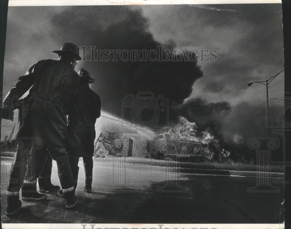 1972 Press Photo Milwaukee firemen spray foam on gasoline truck, Jones Island- Historic Images