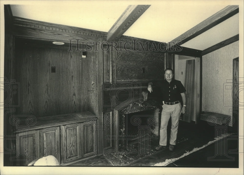 1983 Press Photo Peter K. Johnson showing off some of the custom wood work. - Historic Images