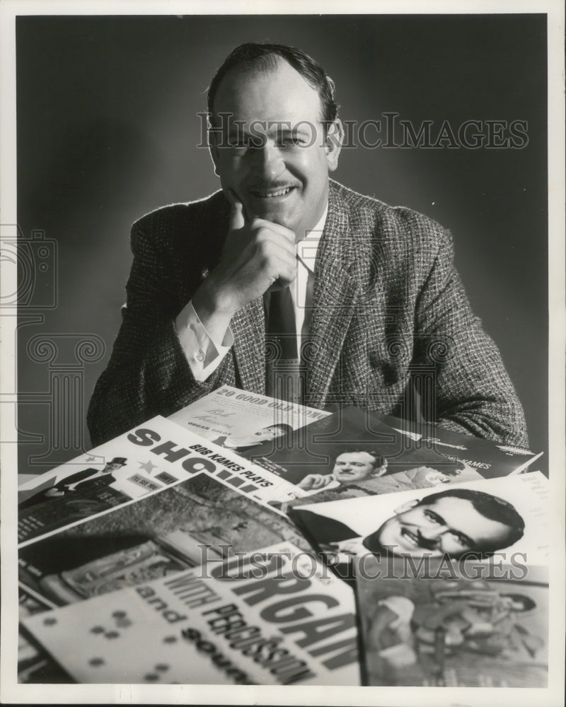 1962 Press Photo Organist Bob Kames with some of his albums - mjb76620- Historic Images