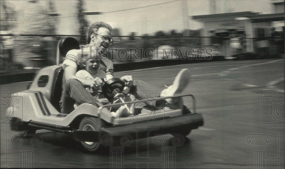 1983 Press Photo Go Karts enthralled this family last summer - mjb77195- Historic Images