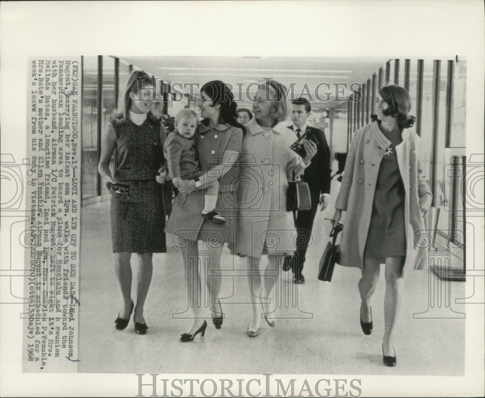 1968 Press Photo Luci Johnson Nugent carries son Lyn, with friends at airport- Historic Images