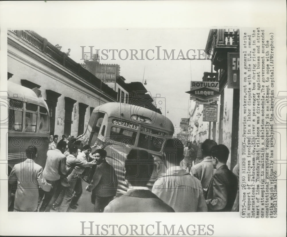 1956 Press Photo Rioters tip bus in Downtown Lima, Peru during labor dispute- Historic Images