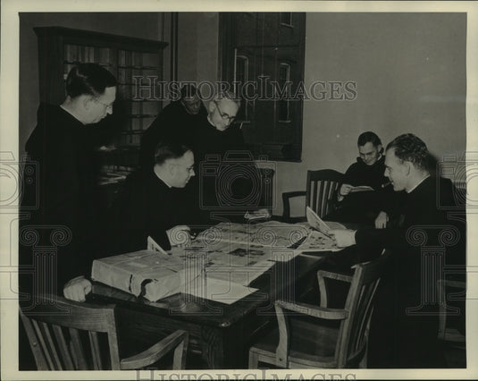 1941 Press Photo St. John's Abbey clerics browsing newspapers in their downtime- Historic Images
