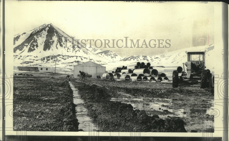 Load image into Gallery viewer, 1971 Press Photo Pipe and equipment stored at Galbraith Lake - mjb80884
