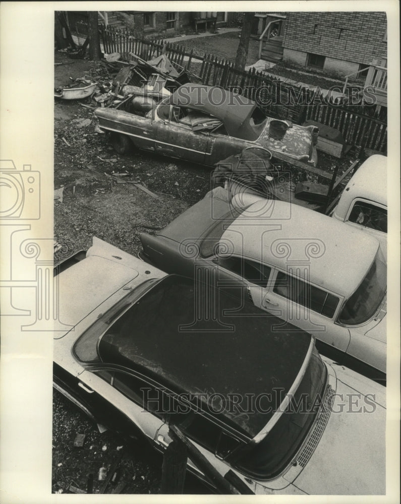 Load image into Gallery viewer, 1966 Press Photo Cars Risk Being Vandalized if left too long in Milwaukee alley
