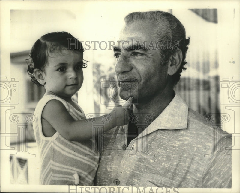 Load image into Gallery viewer, 1971 Press Photo Shahanahah and youngest child, Princess Leila seem happy.
