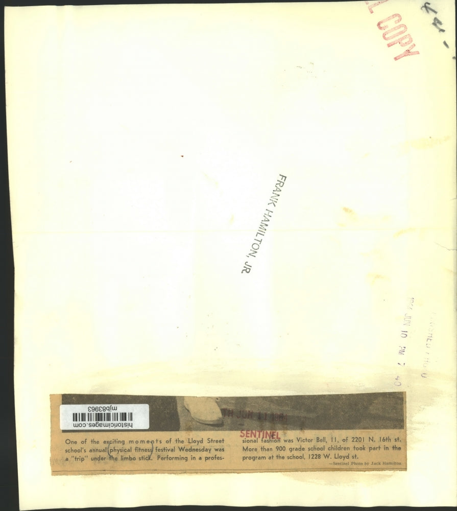 1964 Press Photo Victor Bell limbos. Lloyd St School Physical Fitness Festival