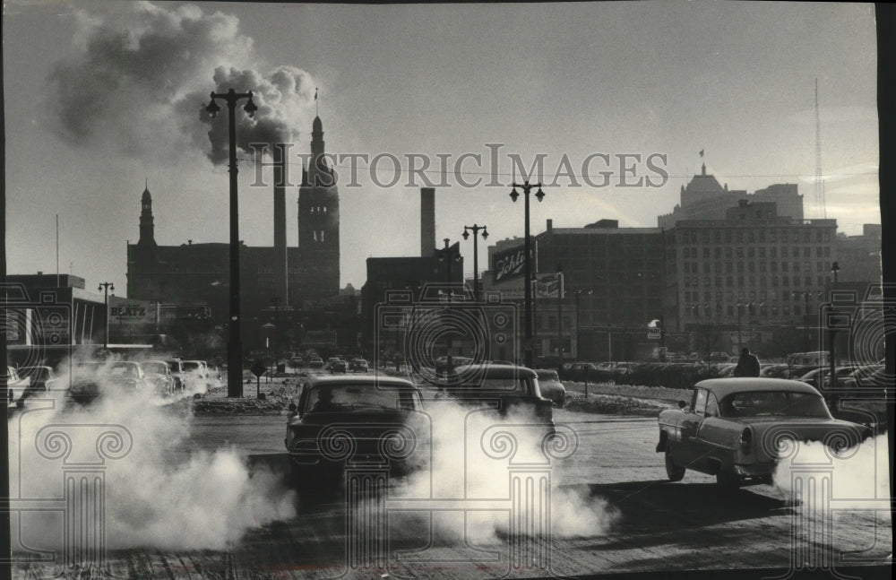 1961 Press Photo Cold winter air holds automobile exhaust close to the ground.- Historic Images