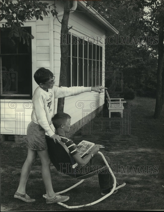 1952 Press Photo Two boys from Lakeside Children's Center enjoying cottage.- Historic Images
