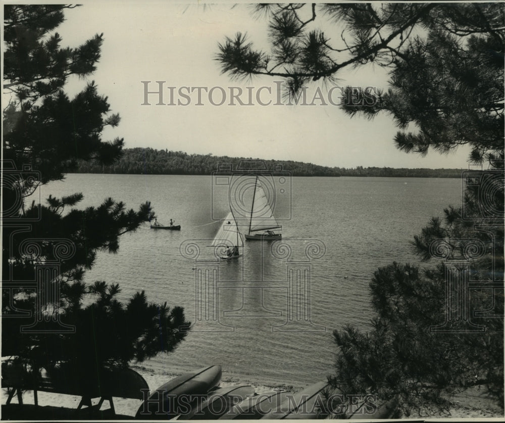 1967 Press Photo Sailboats and Canoe glide over water in Franklin Lake- Historic Images