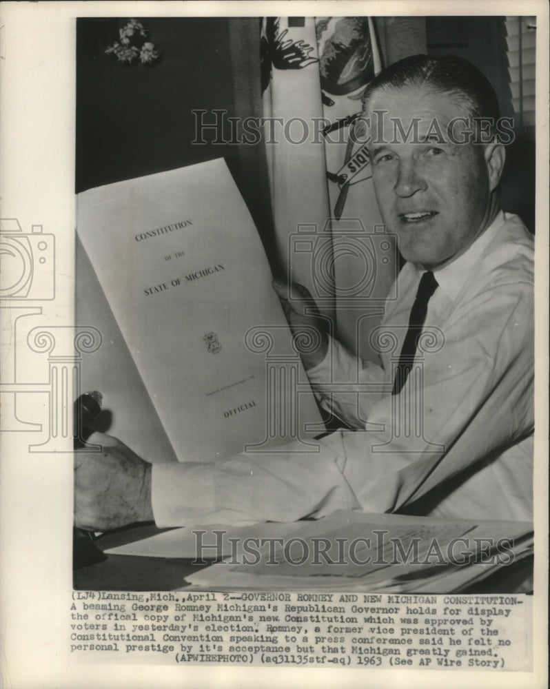 1963 Press Photo Michigan Governor George Romney holds new state constitution