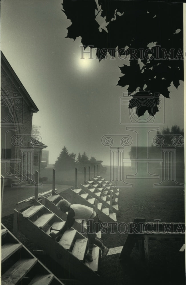 Load image into Gallery viewer, 1967 Press Photo Robert Heikkinen, of Heikkinen Construction Co. works on stairs
