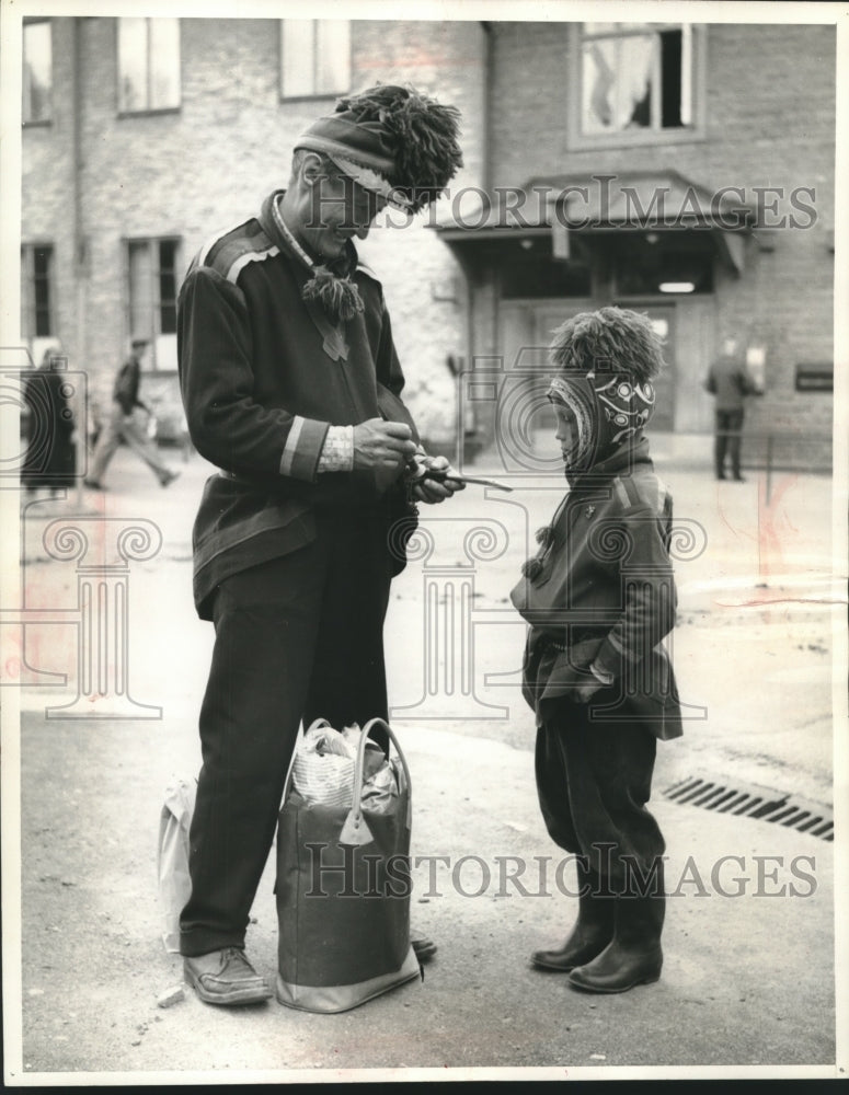 Load image into Gallery viewer, 1968 Press Photo Laplander man &amp; child visit Kiruna, Sweden - mjb98082
