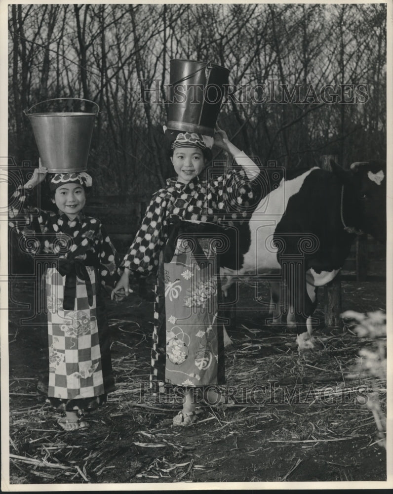 1955 Press Photo Girls, milk buckets on head, traditional dress, Oshima Island- Historic Images