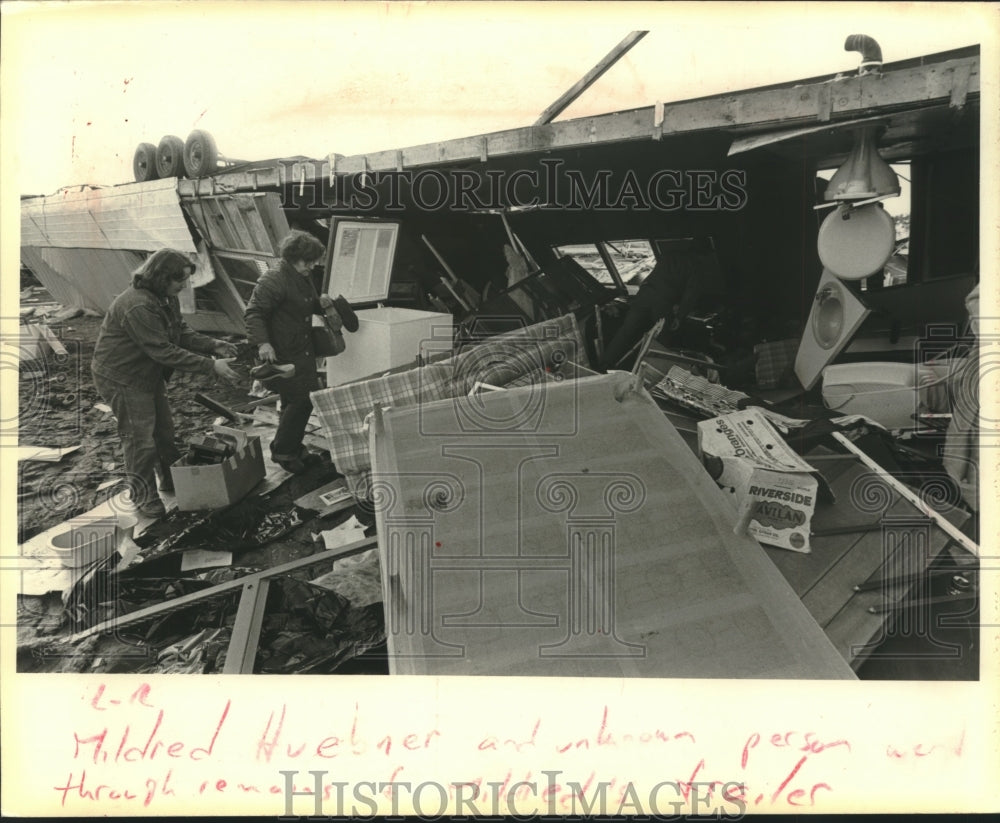1980 Press Photo Mildred Huebner, friend going through tornado debris, Wisconsin
