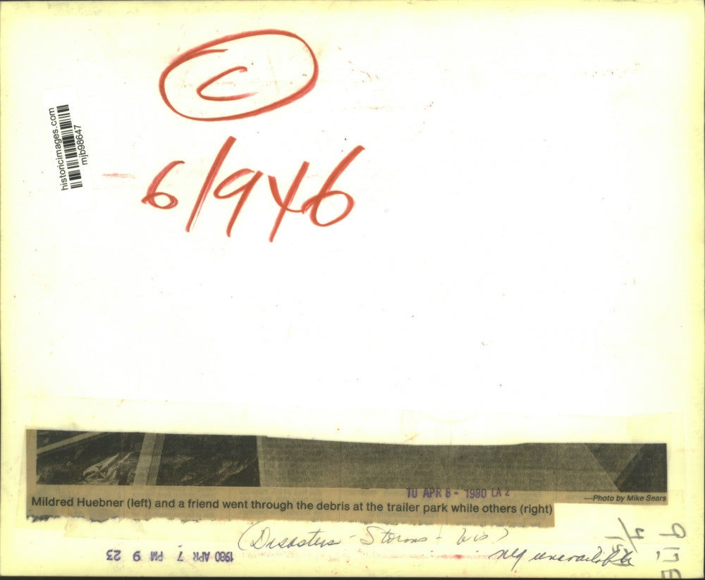 1980 Press Photo Mildred Huebner, friend going through tornado debris, Wisconsin