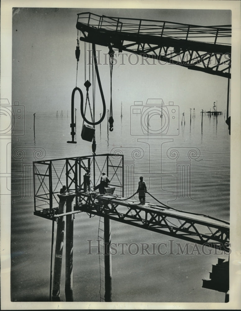 Load image into Gallery viewer, 1962 Press Photo Oil trestle over Caspian Sea on Peschany Island, USSR
