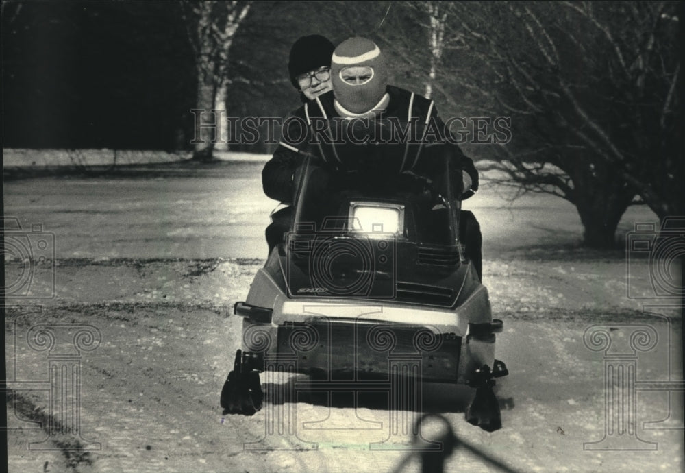 1988 Press Photo Daniel Czubinski got snowmobile ride in Wauwatosa - mjc00805- Historic Images