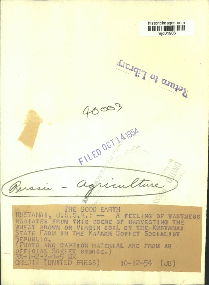 1954 Press Photo Men on harvesters in wheat field, Kustanai, Russia state farm