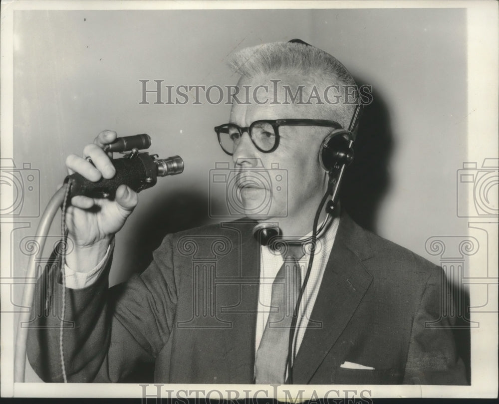 1956 Press Photo Don Goddard, ABC TV commentator show how to use small tv camera- Historic Images