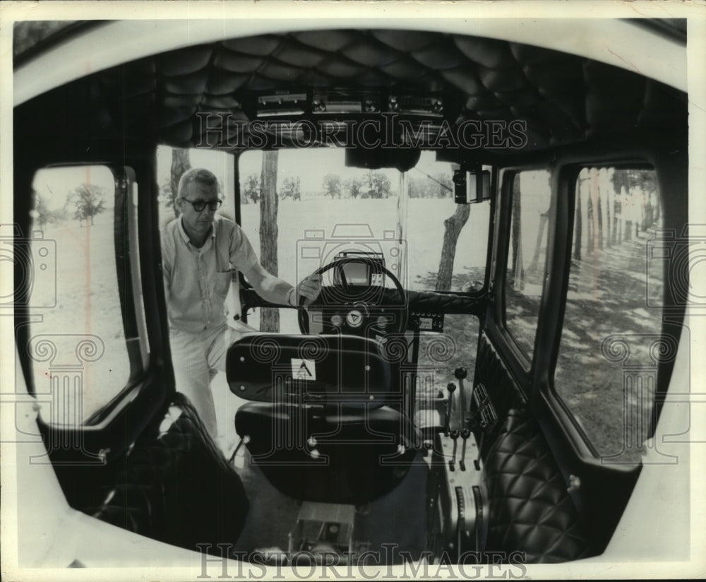 1966 Press Photo Robert Fisher inspects tractor at Farm Progress Days, Wisconsin- Historic Images