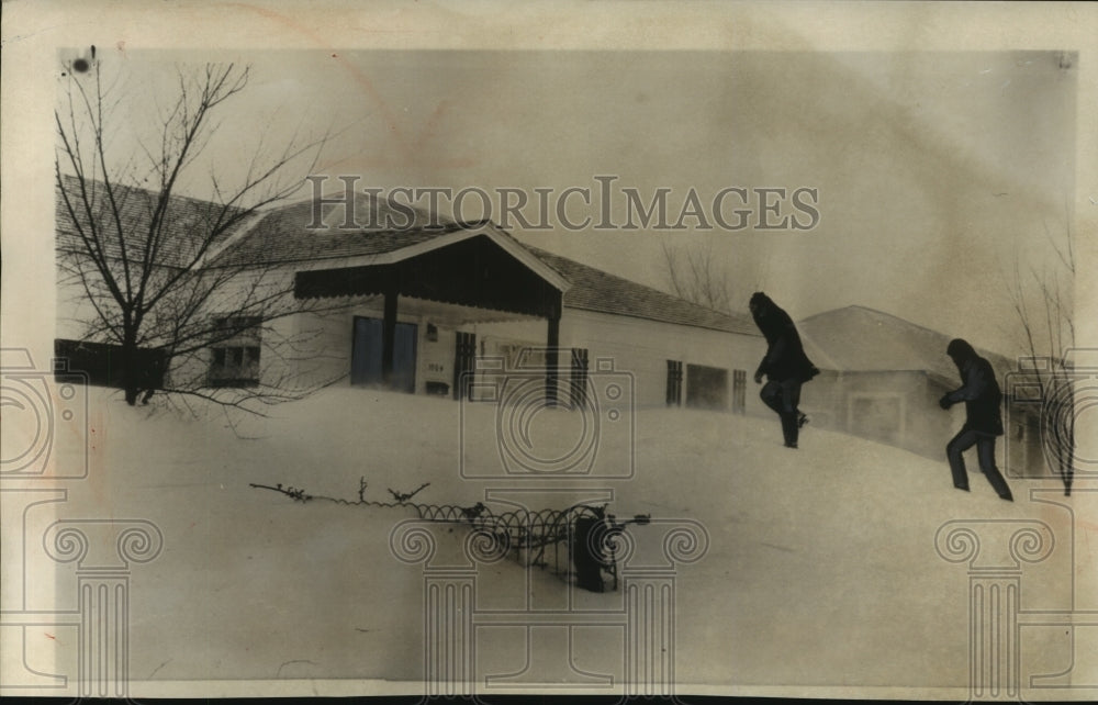 1957 Press Photo Boys on a snowdrift in front of a house in Amarillo, Texas- Historic Images