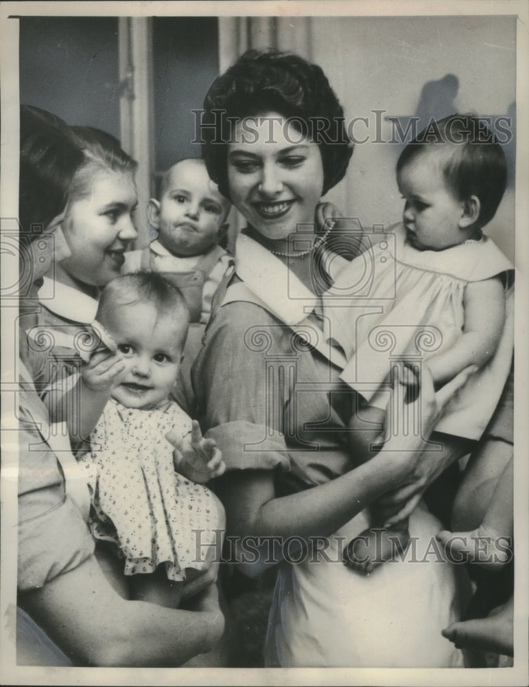 Load image into Gallery viewer, 1958 Press Photo Swedish princess Desiree learns childcare in Stockholm
