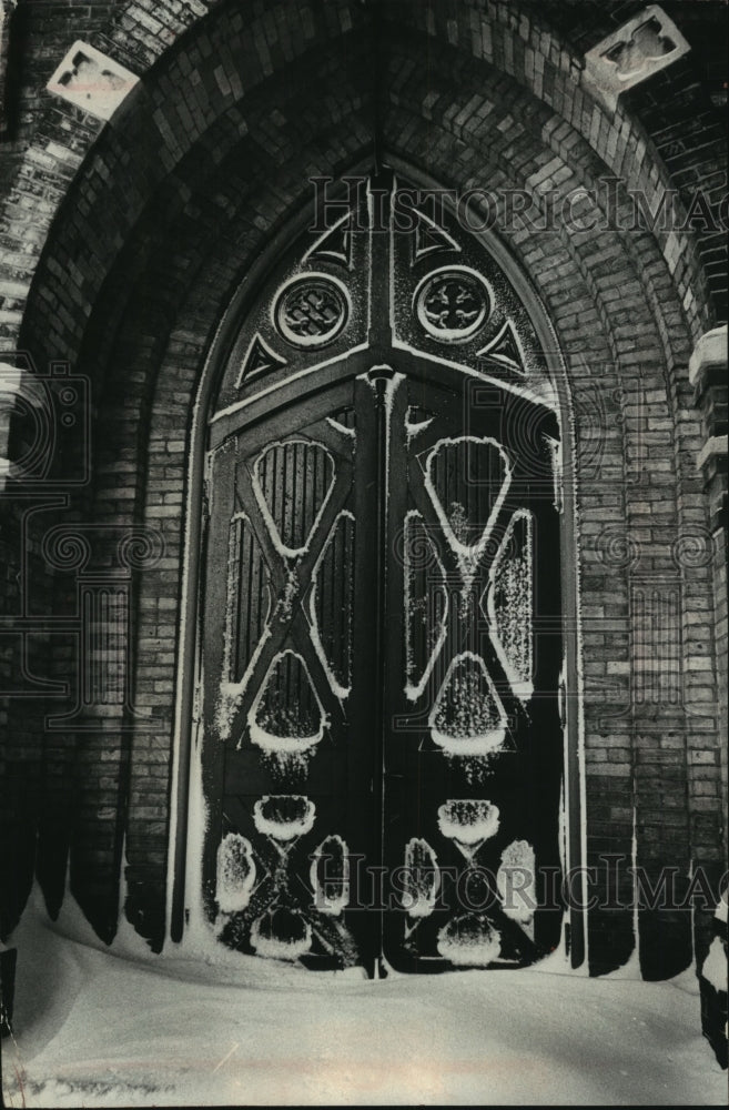 1964 Press Photo Snow stuck to old doors at Trinity Lutheran Church, Milwaukee.- Historic Images
