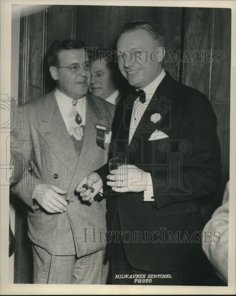 Load image into Gallery viewer, 1953 Press Photo Smiling Howard Wheat Holds Glass and Cigar - mjc19546
