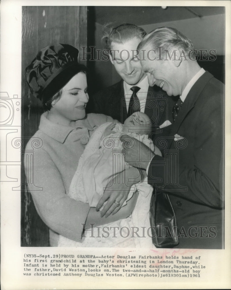 1961 Press Photo Actor Douglas Fairbanks Holds Hand of First Grandchild, London- Historic Images