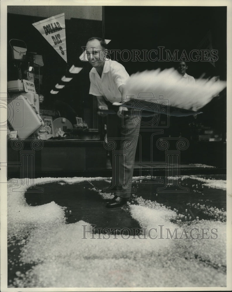 1956 Press Photo Marvin Lubinsky shovels hail after storm,Fond du Lac, Wisconsin- Historic Images