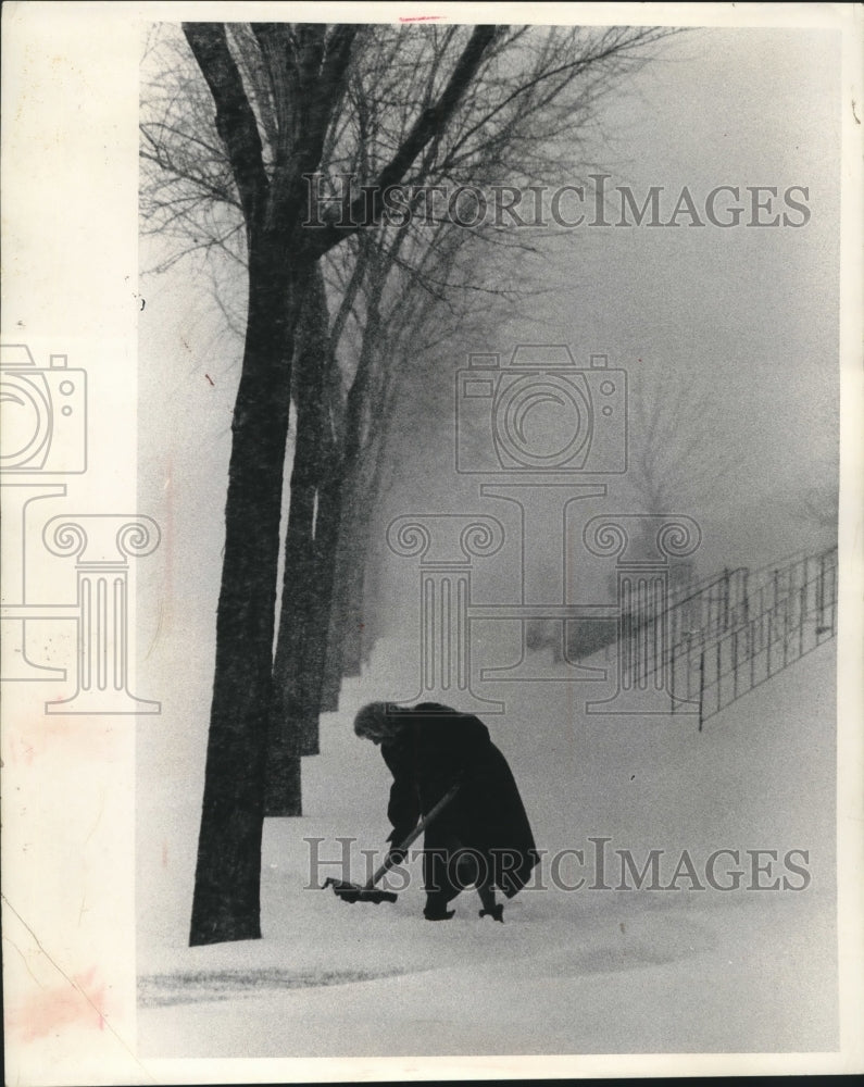 1966 Press Photo Mrs. Harvey E. Brossmann shoveling snow, Milwaukee, Wisconsin- Historic Images