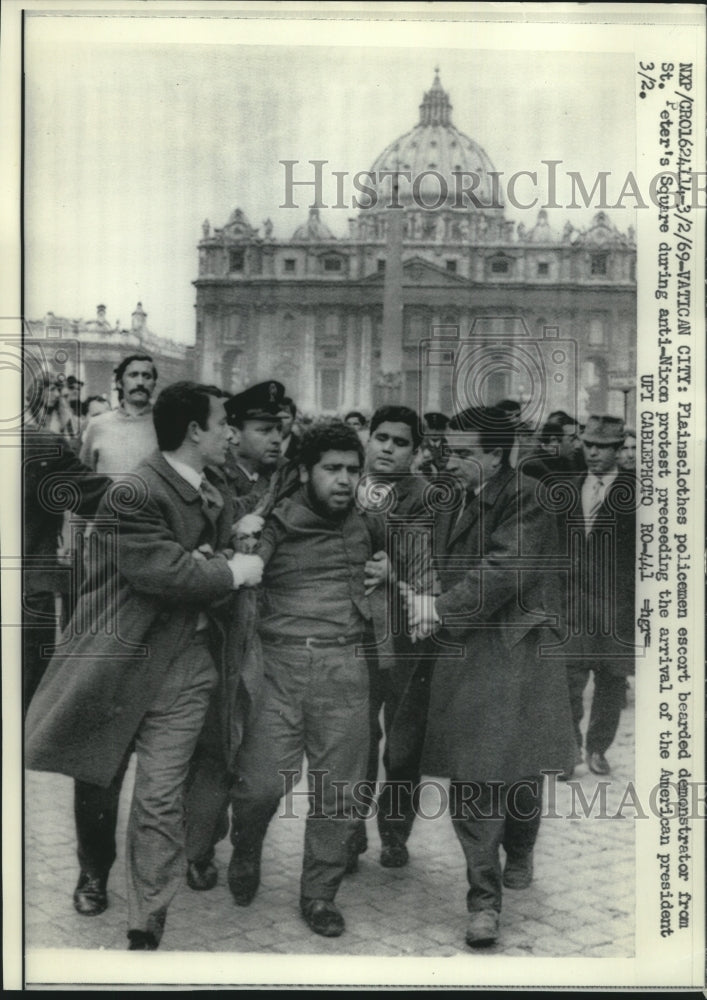 1969 Press Photo Policemen escort man from demonstration, Vatican City- Historic Images