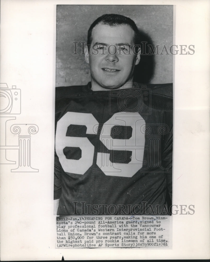 1961 Press Photo Football player Tom Brown signs with Canada&#39;s Vancouver Lions- Historic Images