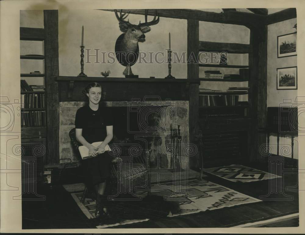 1934 Press Photo Frances Bartlett seated near fireplace - mjc27314