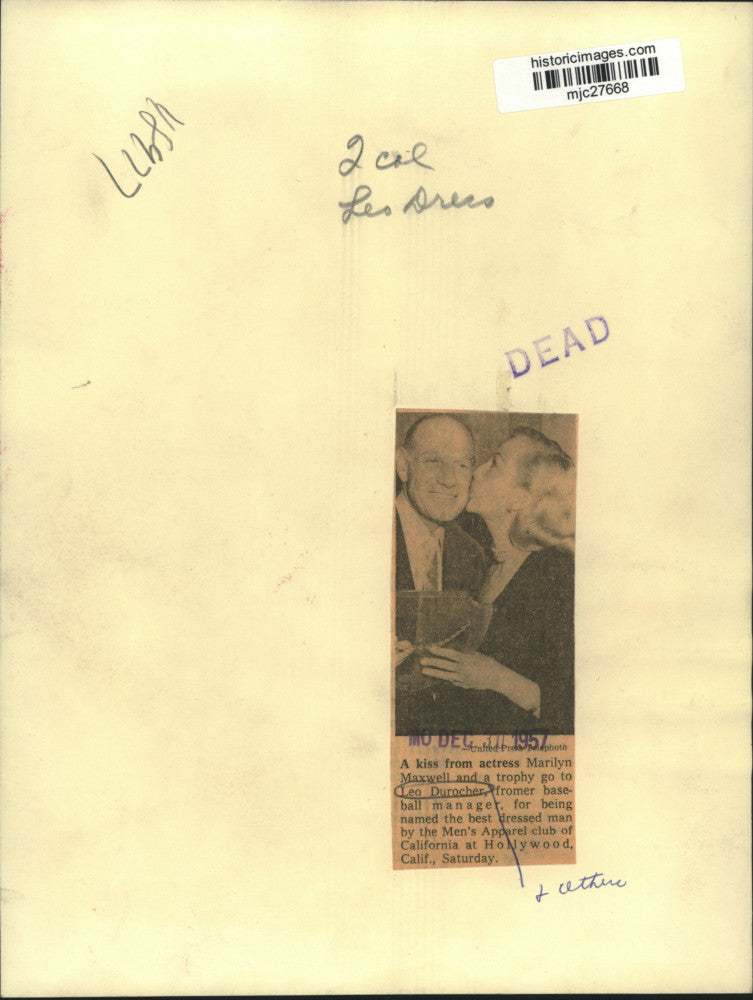 1957 Press Photo Actress Marilyn Maxwell kissing baseball manager Leo Durocher