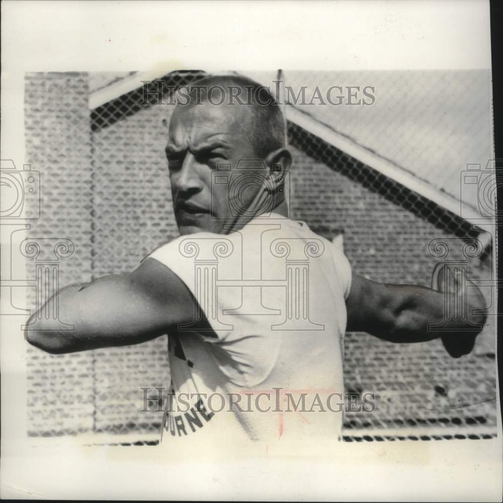 1956 Press Photo Desmond Koch throwing a discus at the Olympic Village- Historic Images