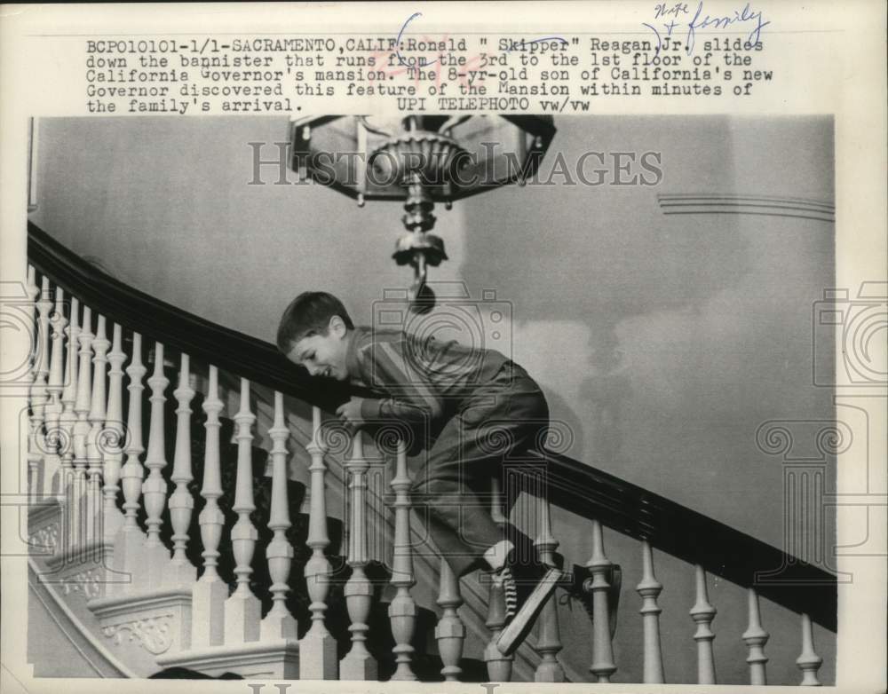 1967 Press Photo Ronald &quot;Skipper&quot; Reagan Jr sliding down bannister, California- Historic Images