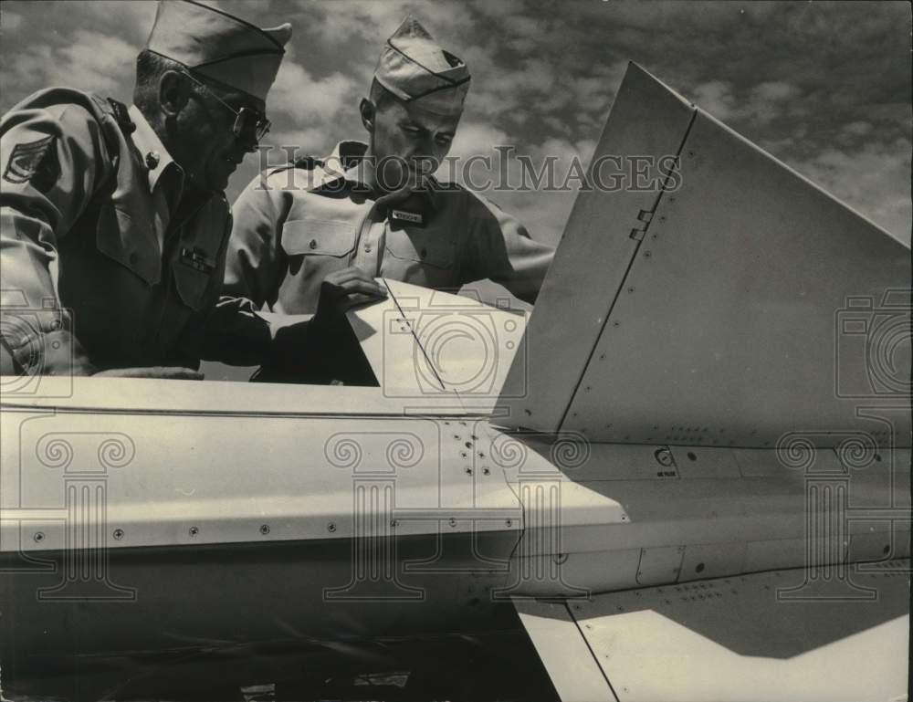 1956 Press Photo 1st Lt. William Henschell &amp; other check Nike missile, Milwaukee- Historic Images