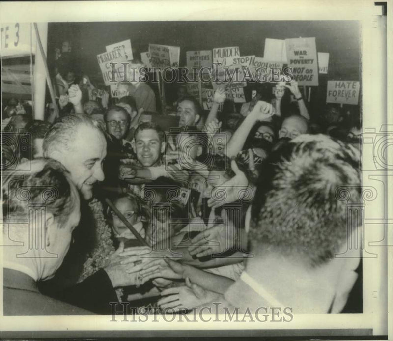 Load image into Gallery viewer, 1966 Press Photo Johnson shakes hands of supporters and ignores protests, Hawaii
